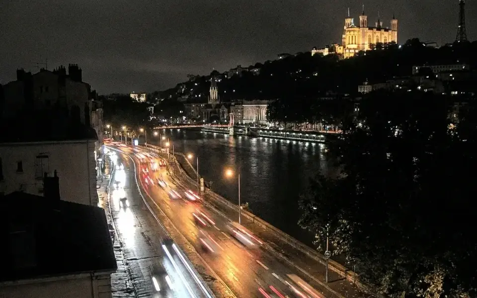 Lyon at night from an elevated traffic-camera viewpoint, one of the seven Rush Hour feeds