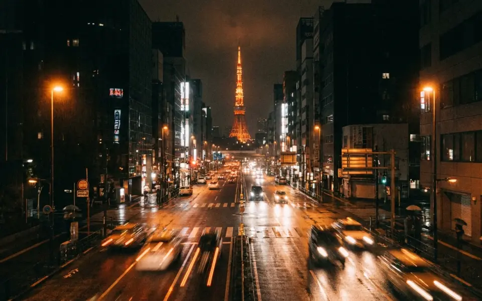Tokyo junction at night from an elevated traffic-camera viewpoint, the kind of fixed feed Rush Hour counts vehicles on